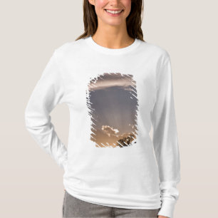 Crepuscular rays radiate across the sky at T-Shirt