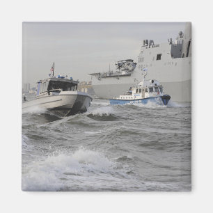 Crews from the coast guard and police departmen magnet