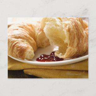Croissant with jam on a plate postcard