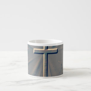 CROSS POPPING OUT FROM ROCK ESPRESSO CUP