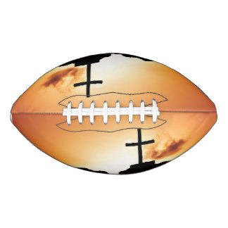 Cross silloette at dusk american football