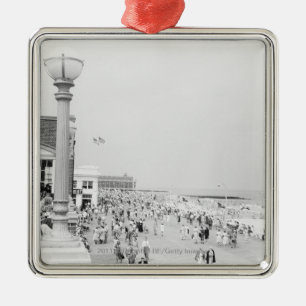 Crowds on esplanade metal tree decoration