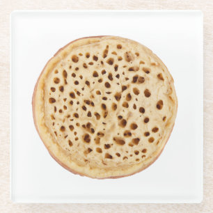 Crumpet on white glass coaster