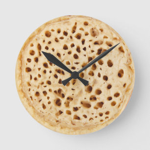Crumpet on white round clock