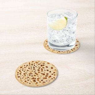 Crumpet on white round paper coaster