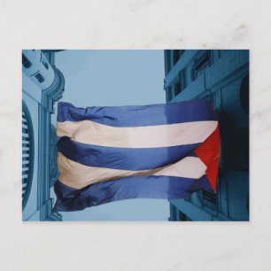 Cuban flag between buildings in Havana, Cuba Postcard