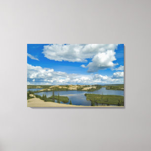 Cumulus clouds float above lakes, Northwest Canvas Print