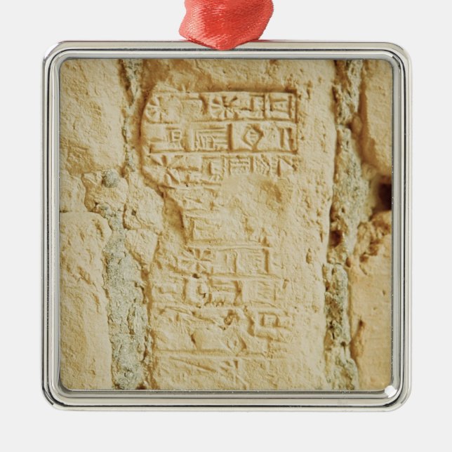 Cuneiform script on a palace wall metal tree decoration (Front)