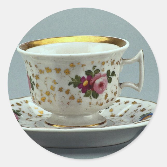 Cup and saucer with colourful flower designs on it classic round sticker (Front)