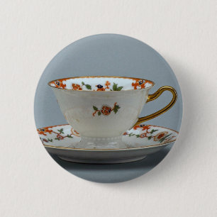 Cup and saucer with colourful flowers on it. 6 cm round badge