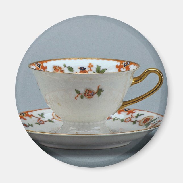 Cup and saucer with colourful flowers on it. magnet (Front)