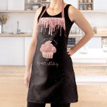 Cupcake Rose Gold Glitter Drips Black Bakery Chef Apron<br><div class="desc">Here’s a wonderful way to add to the fun of baking. Add extra sparkle to your culinary adventures whenever you wear this elegant, sophisticated, simple, and modern apron. A sparkly, dark rose gold cupcake, glitter drips, and light pink handwritten script typography overlay a black damask pattern ombre background. Personalise with...</div>