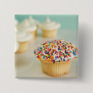 Cupcakes, focus on one in front with 15 cm square badge