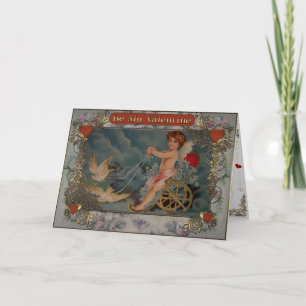 Cupid riding a trolley with pigeons. holiday card