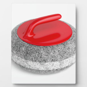 Curling stone on white plaque