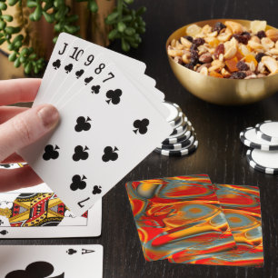 Curved staines with scratched red to orange on ice playing cards