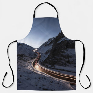 CURVY ROAD IN MIDDLE OF SNOW COVERED MOUNTAIN APRON