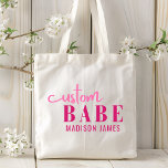 Custom Babe Funny Saying Personalised Name Tote Bag<br><div class="desc">Custom Babe Funny Saying Personalised Name Tote Bags features a simple design with the text "custom babe" in modern pink calligraphy script typography and personalised with your name. Perfect for a fun gift for mum, best friends, girlfriend, for birthday, Christmas, holidays, Mother's Day and more. Designed by Evco Studio www.zazzle.com/store/evcostudio...</div>