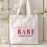 Custom Babe Funny Saying Personalised Name Tote Bag<br><div class="desc">Custom Babe Funny Saying Personalised Name Tote Bags features a simple design with the text "custom babe" in modern pink calligraphy script typography and personalised with your name. Perfect for a fun gift for mum, best friends, girlfriend, for birthday, Christmas, holidays, Mother's Day and more. Designed by Evco Studio www.zazzle.com/store/evcostudio...</div>