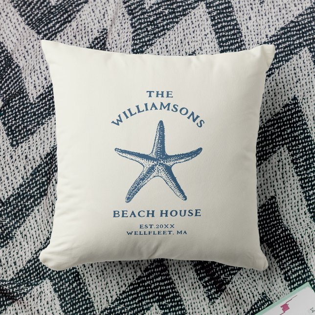 Custom Blue Coastal Starfish Beach House Cushion (A white decorative pillow features a blue starfish design with text "The Williamsons Beach House")