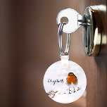 Custom cute Robin bird in snow add name Key Ring<br><div class="desc">Feeding the birds during the cold winter season. A cute Robin coming to a garden,  backyard for the sunflower seeds lying in the snow. Customize and add a name,  black letters.</div>