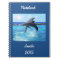 Custom dolphins playing in the ocean doing tricks