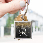 Custom Gold Glitter Black Sparkle Monogram Key Ring<br><div class="desc">Easily personalise this trendy elegant keychain design featuring pretty gold sparkling glitter on a black brushed metallic background.</div>