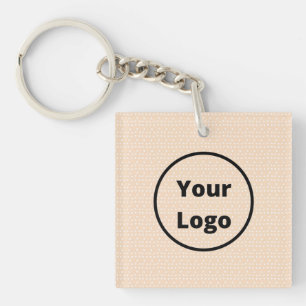 Custom logo on tiny white dots on blush key ring