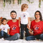 Custom Mele Kalikimaka Santa Hawaiian Christmas  T-Shirt<br><div class="desc">Celebrate Christmas with a tropical twist! This Custom Mele Kalikimaka t-shirt features a laid-back Santa in a Hawaiian shirt and sunglasses, carrying a surfboard. Personalise it with your family name, favourite Hawaiian destination, and year. Perfect for adding island vibes to your holiday festivities, this fun and unique shirt brings aloha...</div>
