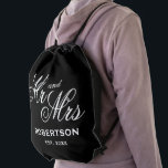 Custom Mr and Mrs name newly weds wedding Drawstring Bag<br><div class="desc">Custom Mr and Mrs name newly weds wedding Drawstring bag. Personalised backpack for just married couple.  Add your own personalised surname and established date of marriage. Handy for goodies,  party favours,  sports,  hiking,  travel and more. Black and white or custom colour. Elegant typography template for bride and groom.</div>