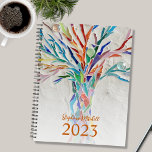 Custom Name 2023 Planner<br><div class="desc">This unique Planner is decorated with a brightly coloured mosaic tree. Customise it with your name and year. To edit further use the Design Tool to change the font, font size, or colour. Because we create our artwork you won't find this exact image from other designers. Original Mosaic © Michele...</div>