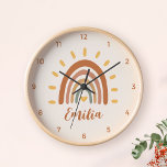 Custom Name Boho Earth Tone Rainbow Sun Clock<br><div class="desc">The Custom Name Boho Earth Tone Rainbow Sun wall clock is a unique and stylish piece of home decor that combines bohemian and earthy elements with a vibrant rainbow sun. In addition to the striking graphic, the clock can also be customised with your own name, making it a truly personalised...</div>