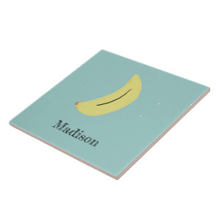 Custom name painted banana on blue tile