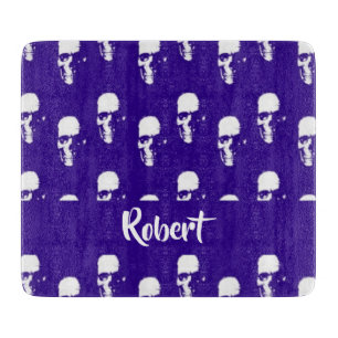 Custom name skulls on blue cutting board