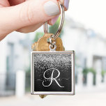 Custom Silver Glitter Black Sparkle Monogram Key Ring<br><div class="desc">Easily personalise this trendy elegant keychain design featuring pretty silver sparkling glitter on a black brushed metallic background.</div>