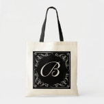 Custom vintage monogram letter wedding tote bag<br><div class="desc">Custom vintage monogram letter wedding wedding tote bag with swirls. Classy black and white retro design with elegant script typography and swirly corners. Personalise with name or monogram of bride, bridesmaid, maid of honour, mother of the bride, flower girl etc. Also perfect for classic wedding favours. Stylish monogrammed wedding logo...</div>