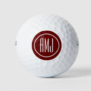 Customise red and white monogram golf balls