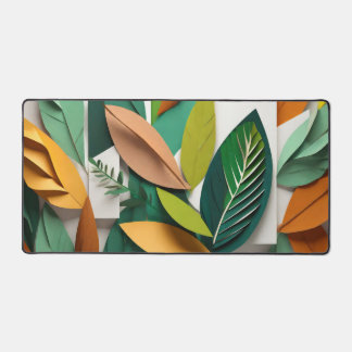Cut paper leaves in green and gold desk mat