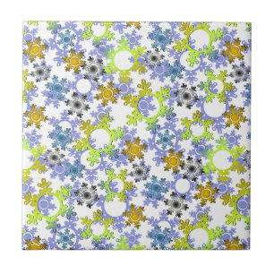 Cut paper snowflakes multicolored on white tile