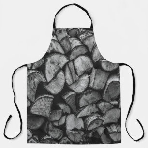 Cut Tree Logs Stacked Together Black & White Photo Apron