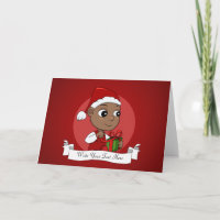 Cute African American baby with a Santa hat
