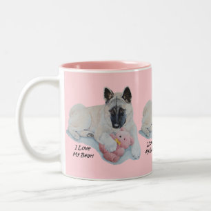 cute akita cuddling pink teddy bear dog portrait Two-Tone coffee mug