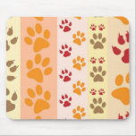 Cute Animal Paw Prints Pattern in Natural Colors Mouse Mat<br><div class="desc">A cute design with several rows of animal paw prints in natural colors like brown,  yellow,  red and orange on a striped pattern. Some paws have claws and others do not.</div>