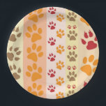 Cute Animal Paw Prints Pattern in Natural Colours Paper Plate<br><div class="desc">A cute design with several rows of animal paw prints in natural colours like brown,  yellow,  red and orange on a striped pattern. Some paws have claws and others are smooth.</div>