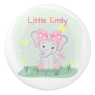 Cute baby elephant with a pink bow in a clearing  Ceramic Knob