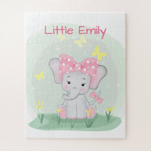 Cute baby elephant with a pink bow in a clearing Jigsaw Puzzle