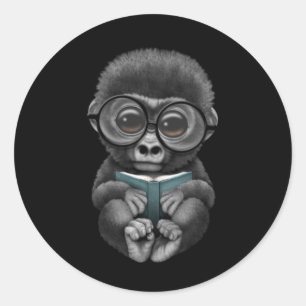 Cute Baby Gorilla Reading a Book on Black Classic Round Sticker