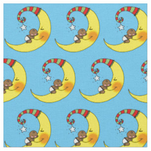 cute baby sleeping on yellow moon nursery fabric