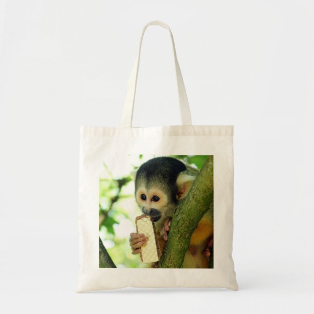 Cute Baby Squirrel Monkey Eating a Wafer Biscuit Tote Bag (Front)