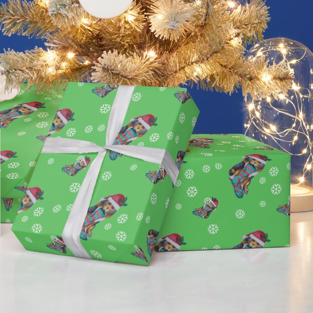 cute black and brown puppy dressed for christmas wrapping paper (Holidays)